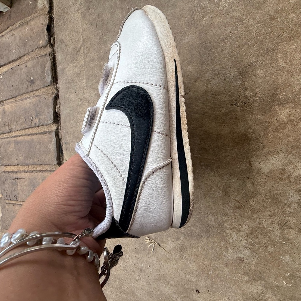 Vintage Nike Classic White Sneakers with Black Swoosh